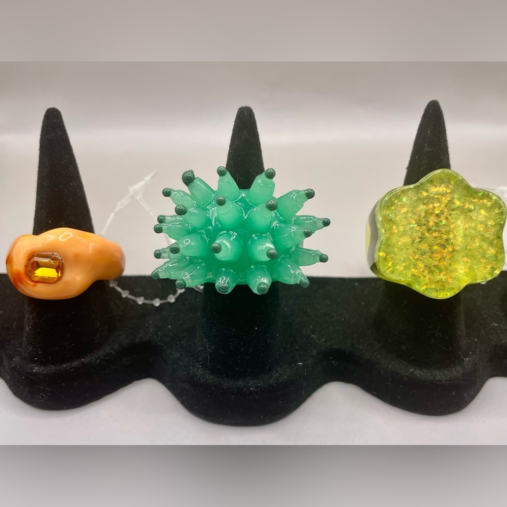 Urban Outfitters set of 3 resin rings. Green urchin, orange, and glitter. Size 6